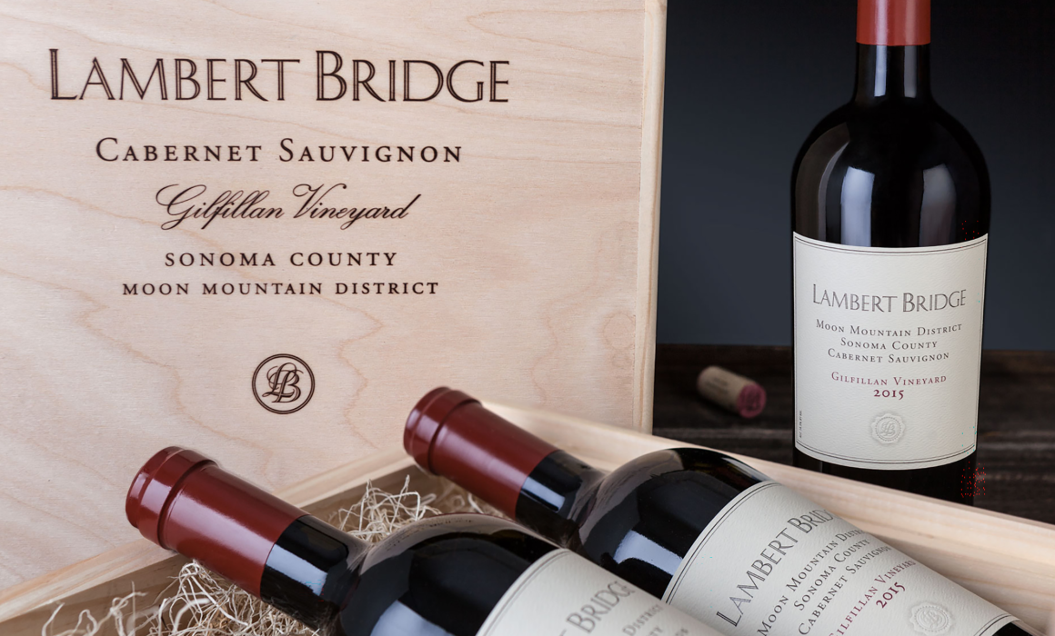 Three bottles of 2015 Lambert Bridge Cabernet Sauvignon, Gilfillan Vineyard, Moon Mountain District with handmade wood box for cellaring
